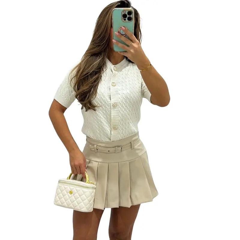Cream ANNA pleated PU leather mini skort, minimalist women’s bottom.