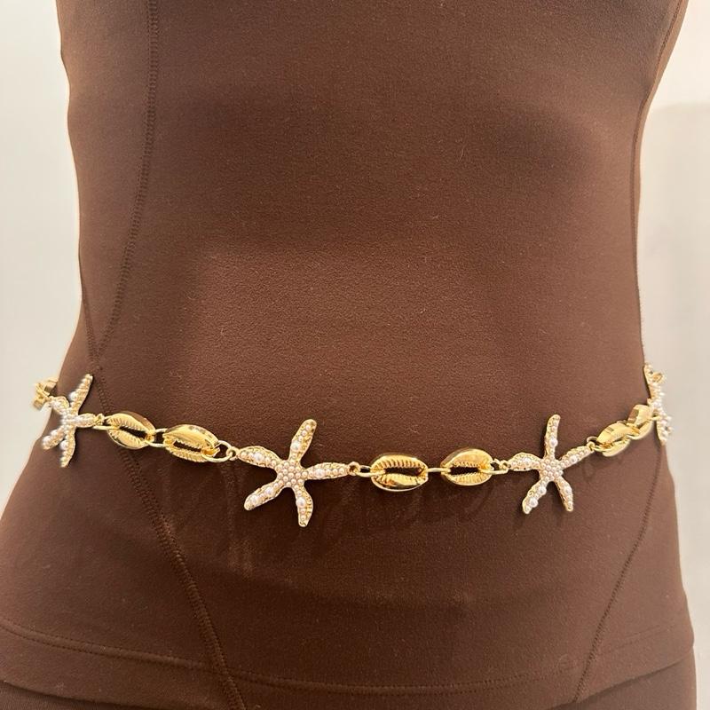Close-up of women’s fashion gold charm belt with double-layered design and coin charms