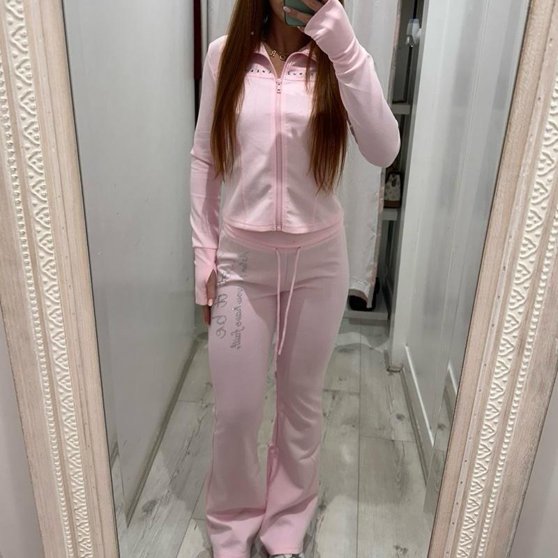 Woman wearing PIXIE Tracksuit Flares with zip-up hoodie and flared joggers on casual day out