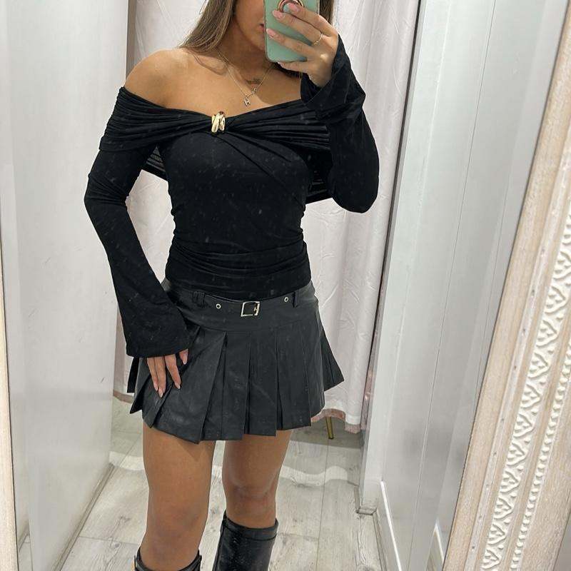 Black AMAYA off-shoulder top with gold buttons and flared long sleeves.