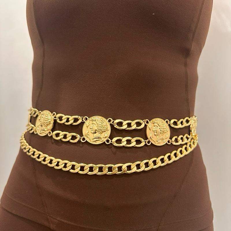 Women’s fashion gold charm belt with double-layered design and coin charms on jeans