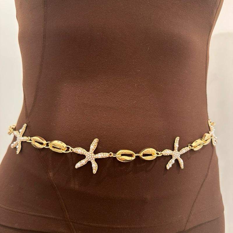Women’s fashion gold charm belt with double-layered design and coin charms on model wearing black outfit
