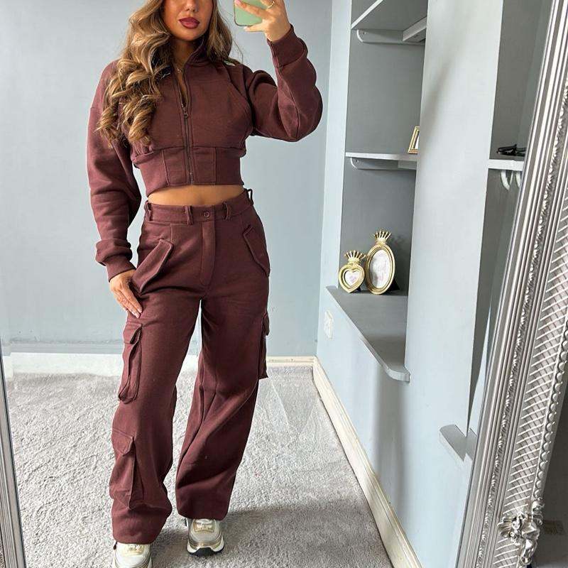 Woman wearing KADIE Zip Up Cropped Top and cargo trouser tracksuit in casual style