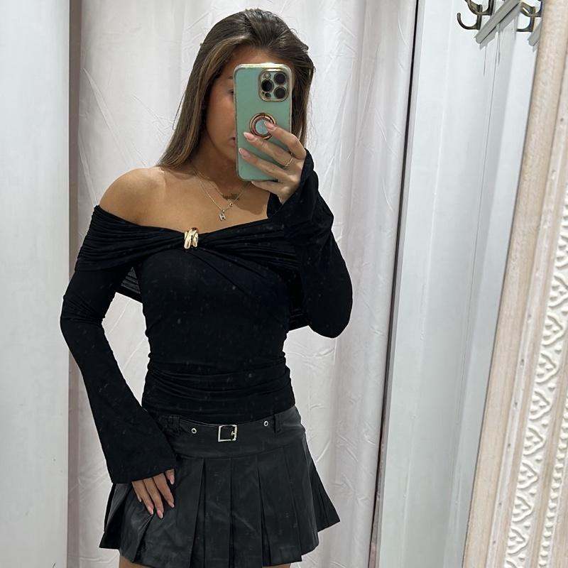 Black AMAYA off-shoulder top with gold buttons and flared long sleeves.