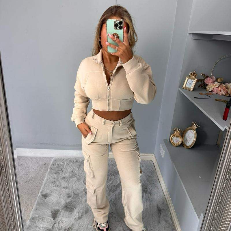 Woman wearing KADIE Zip Up Cropped Top and cargo trouser tracksuit in casual outdoor setting