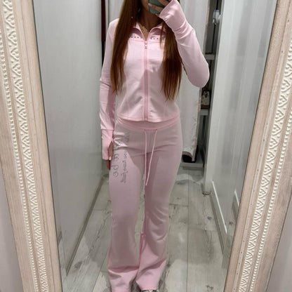 Woman wearing PIXIE Tracksuit Flares with zip-up hoodie and flared joggers on casual day out