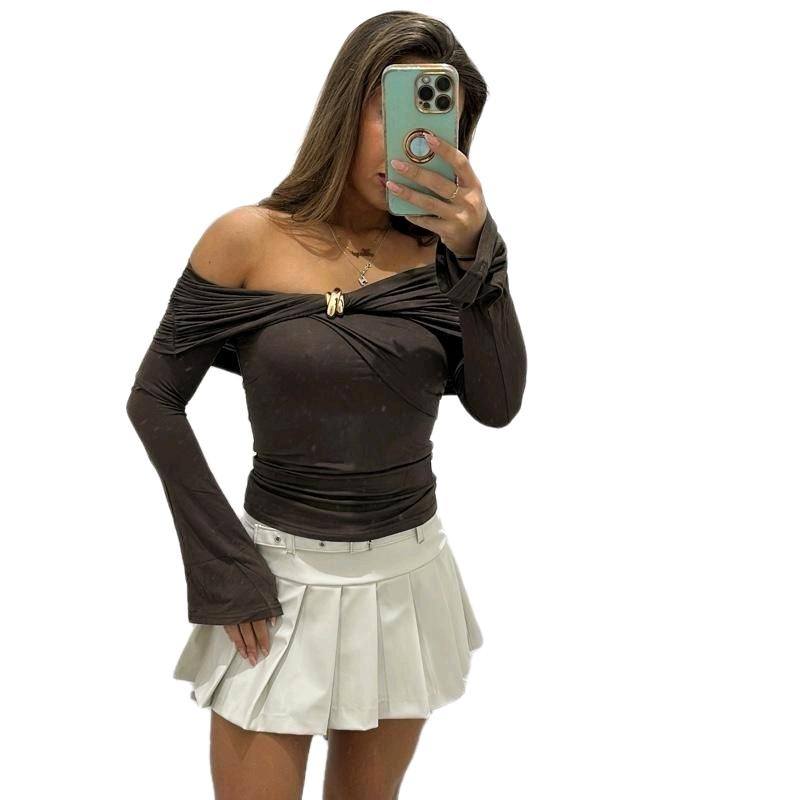 Women’s dark brown AMAYA blouse, off-shoulder design with gold accents.