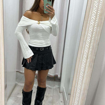 White long sleeve AMAYA top with flared sleeves and gold button details.