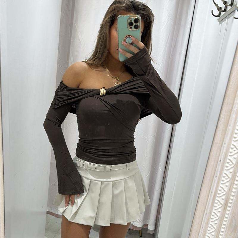 Women’s dark brown AMAYA blouse, off-shoulder design with gold accents.