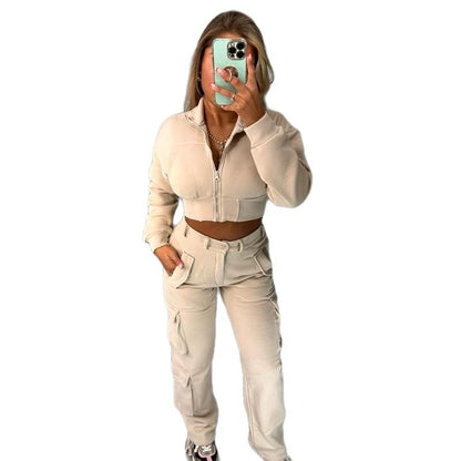Woman wearing KADIE Zip Up Cropped Top and cargo trouser tracksuit coord in beige color with pockets and zipper detail