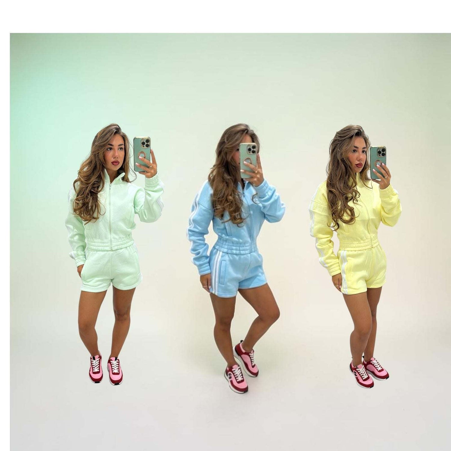Woman wearing fleeced stripe detail short tracksuit set RIRI sitting on stairs outdoors