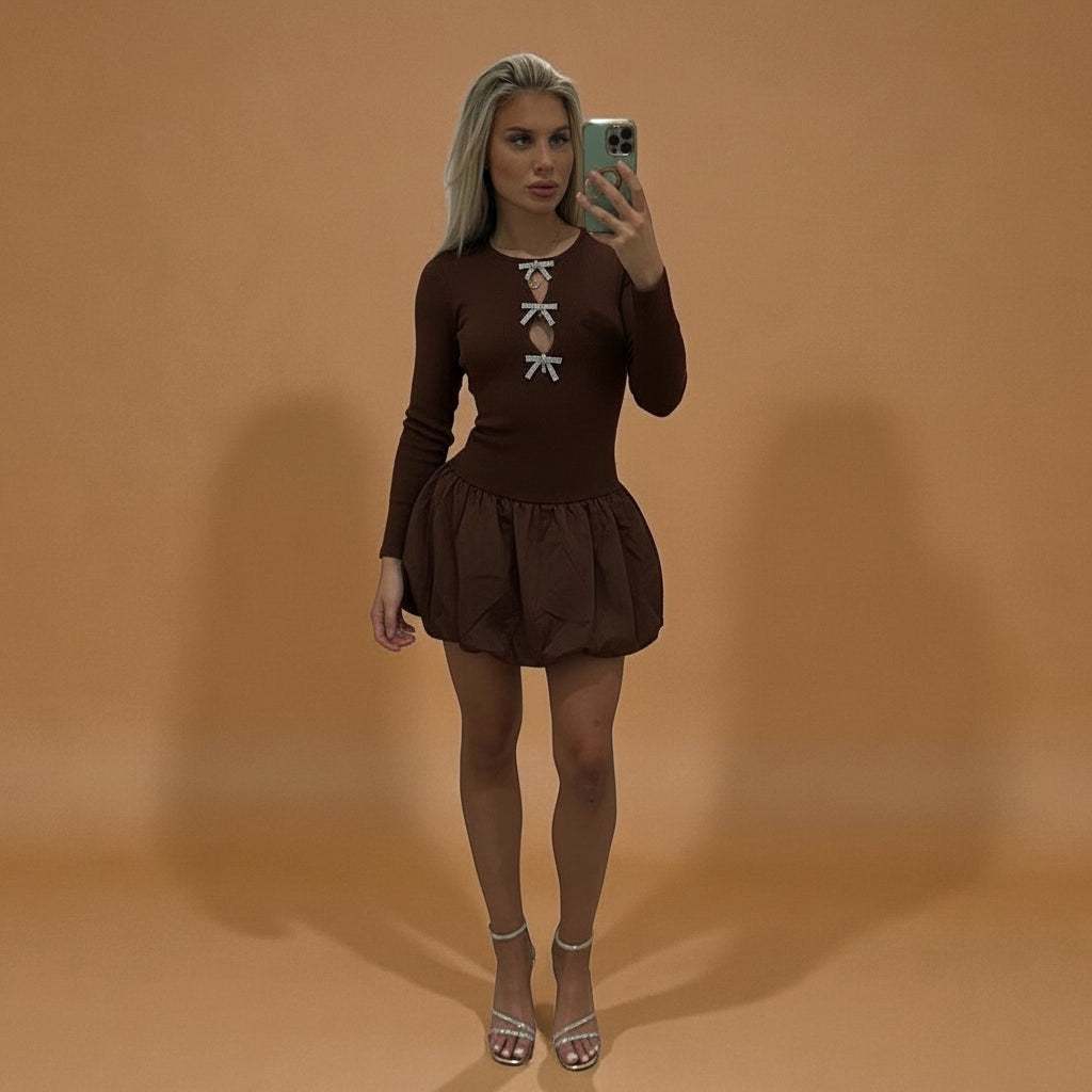 Brown ALLEGRA bow puff dress, long sleeves with ruffled hem, women’s casual wear.
