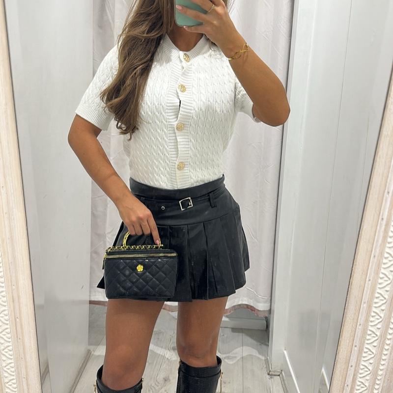 ANNA black pleated PU leather mini skort, elegant minimalist style.