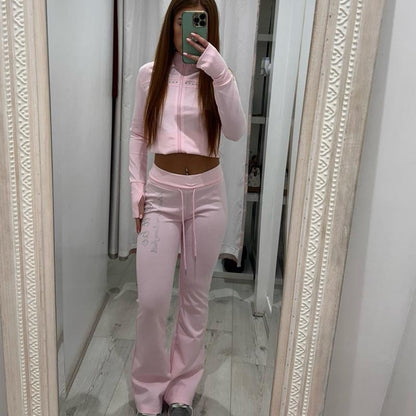 Woman wearing PIXIE Tracksuit Flares zip-up hoodie and matching flared joggers in casual setting
