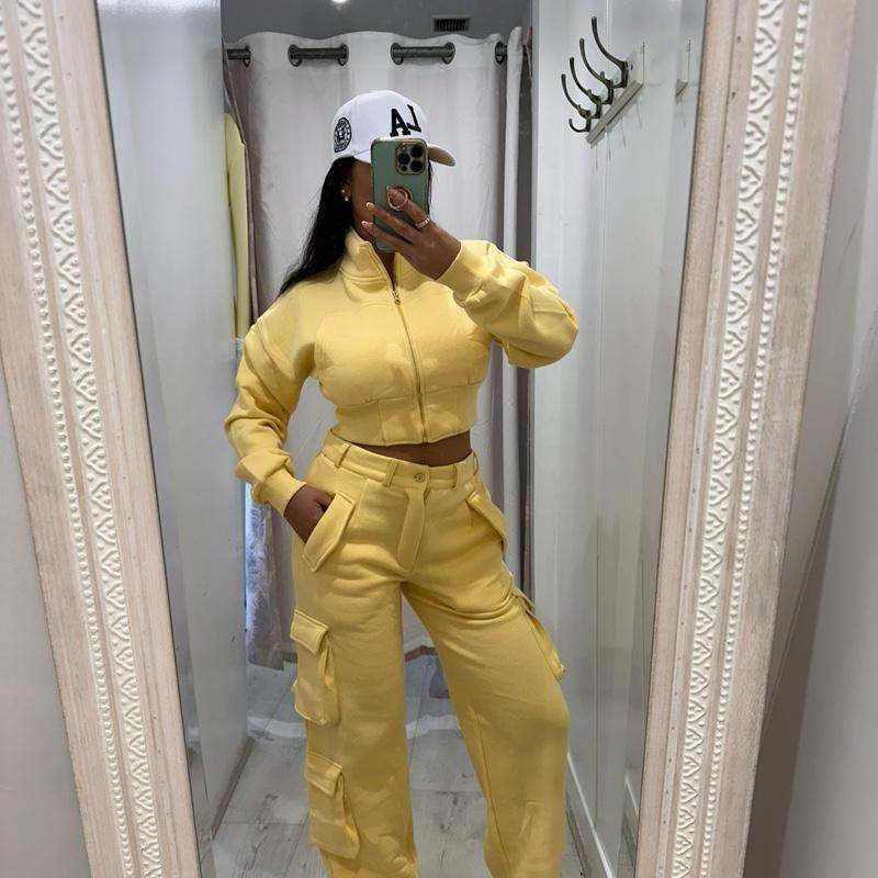 Model wearing KADIE Zip Up Cropped Top and cargo trouser tracksuit coord in beige tones