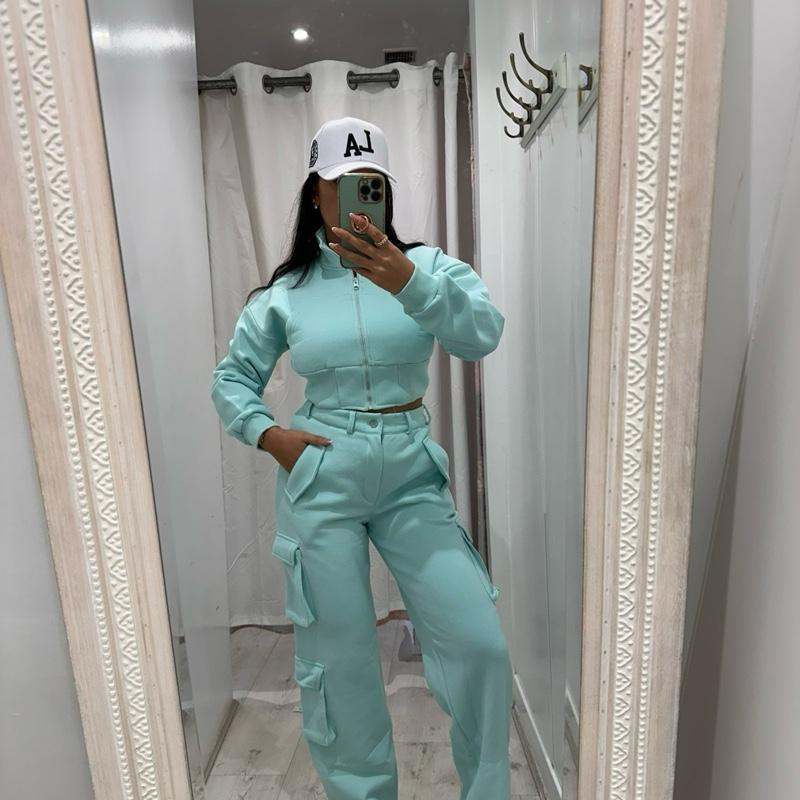 Model wearing KADIE Zip Up Cropped Top and cargo trouser tracksuit in beige and black sporty look