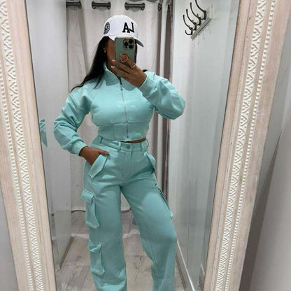Woman wearing KADIE Zip Up Cropped Top and cargo trouser tracksuit in beige casual outfit