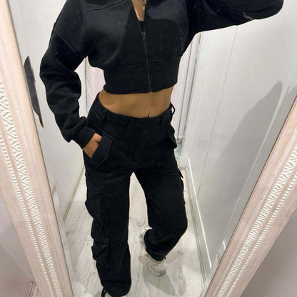 Woman wearing KADIE Zip Up Cropped Top and cargo trouser tracksuit in casual outdoor setting